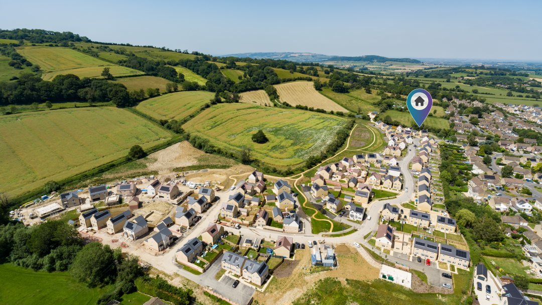 Aerial view of Merret Place with a location pin over the showhome.